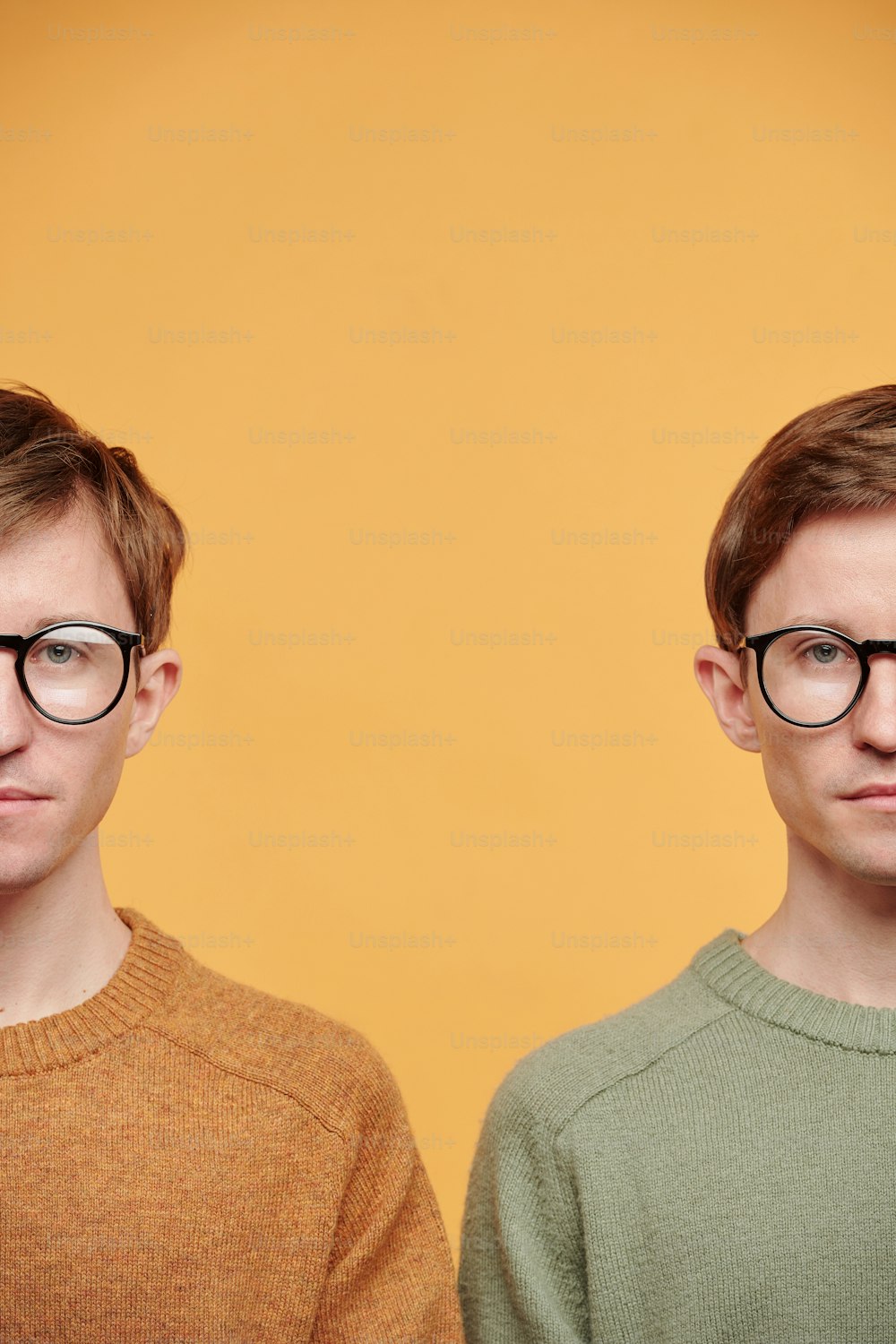 Half faces of tweens in eyewear and bright sweaters standing against orange background