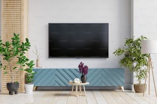 Maqueta de una pared de TV montada en un gabinete en una sala de estar con una pared blanca.3d renderizado