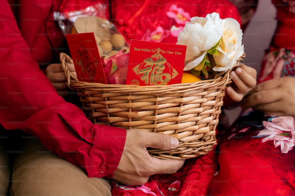 Basket with white flowers and chinese new year postcards