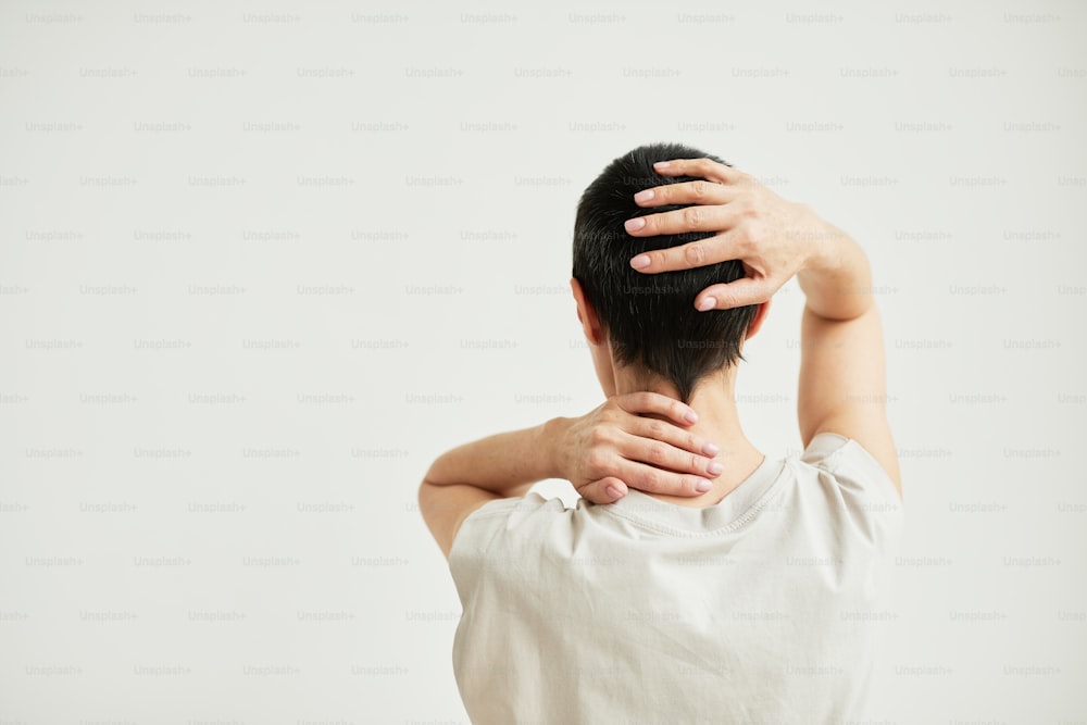 Minimal back view portrait of confident woman with short hair celebrating recovery, copy space