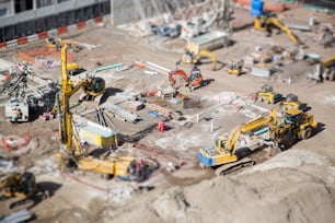 Aerial View of Busy Construction Site with Extreme Tilt-shift Bokeh.
