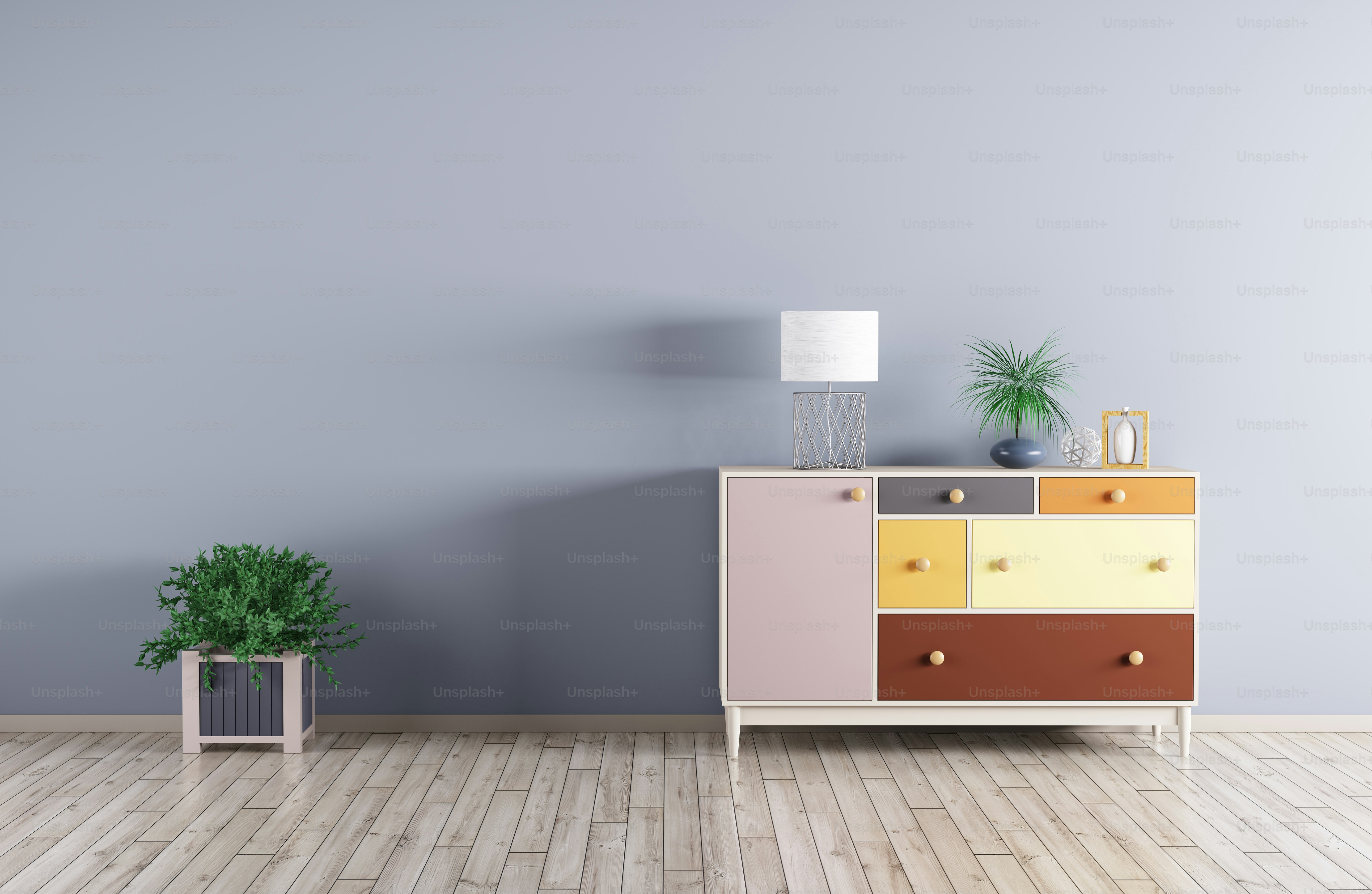 Interior of a room with cabinet and plant over blue wall 3d render