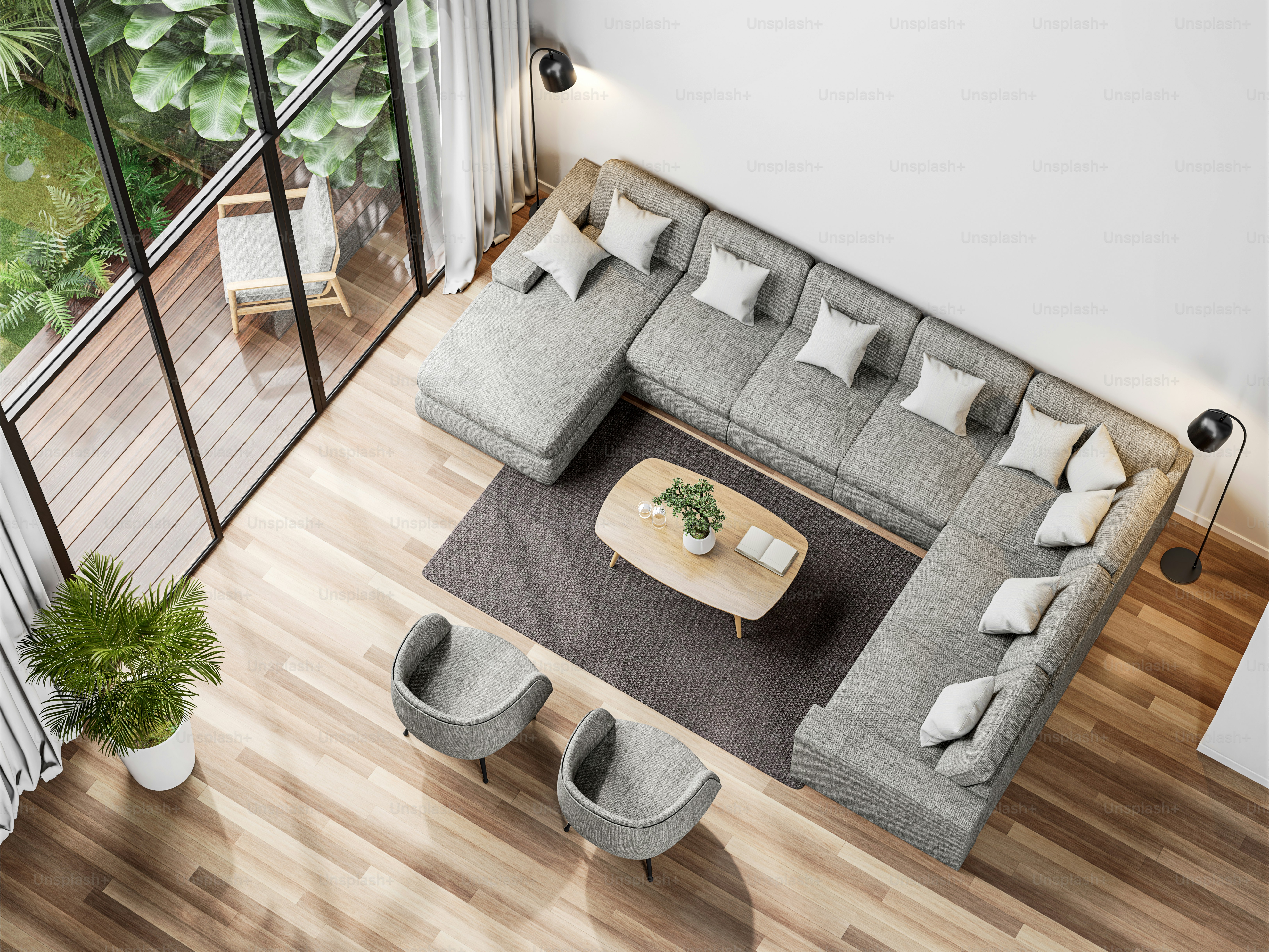 Top view of modern living room with tropical style garden view 3d render,The Rooms have wooden floors ,decorate with gray fabric sofa, Overlooks wooden terrace and green garden.