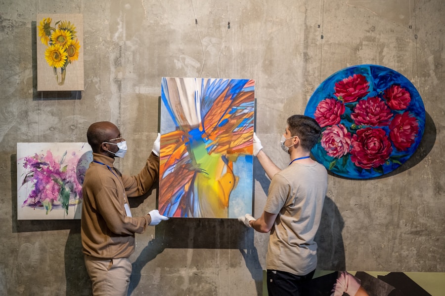 Person examining artwork installed on a gallery wall