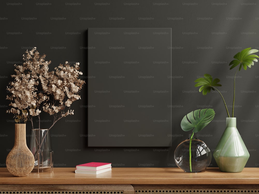 Mockup black frame on cabinet in living room interior on empty dark wall background.3D rendering