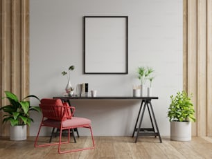 Mockup poster con cornici verticali su parete bianca vuota all'interno del soggiorno con poltrona rossa.3d rendering