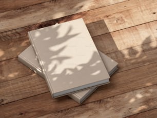 Two Books or Notebooks Mockup with textured kraft paper hardcover on wooden table outdoors. 3d rendering
