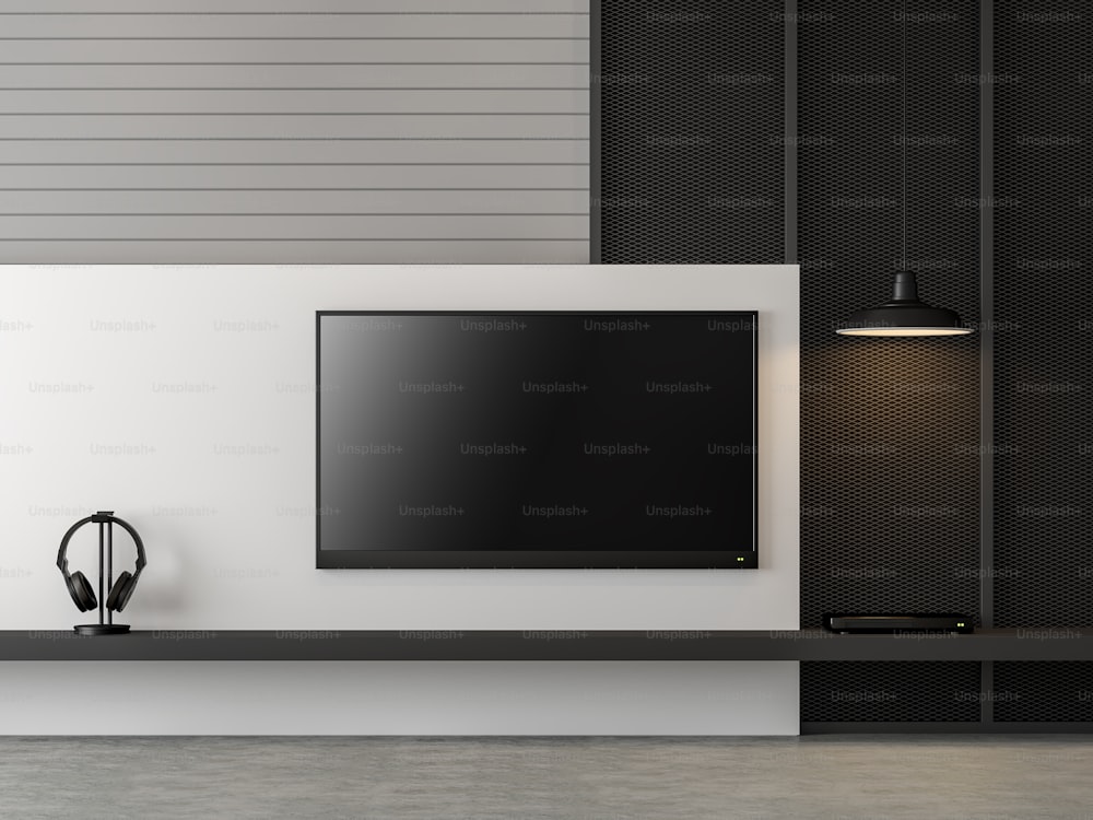 Schermo televisivo vuoto sull'immagine di rendering 3d della parete moderna. Decorare la parete con assi di legno, acciaio nero. C'è un pavimento in cemento lucido e c'è un percorso di ritaglio allo schermo della tv.