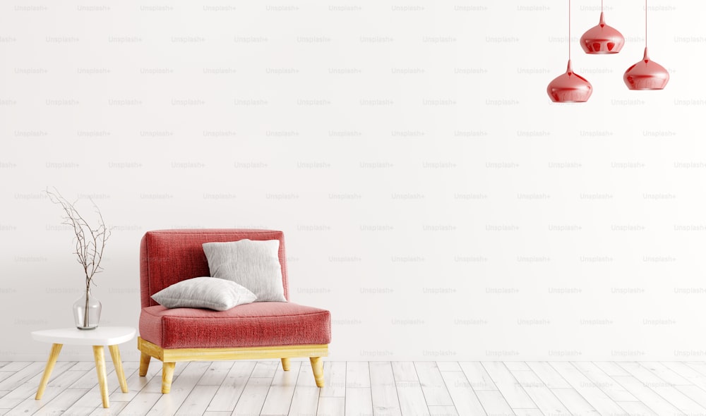 Interno del soggiorno con poltrona in velluto rosso, cuscini grigi, tavolino in legno con vaso e lampade su parete bianca rendering 3d