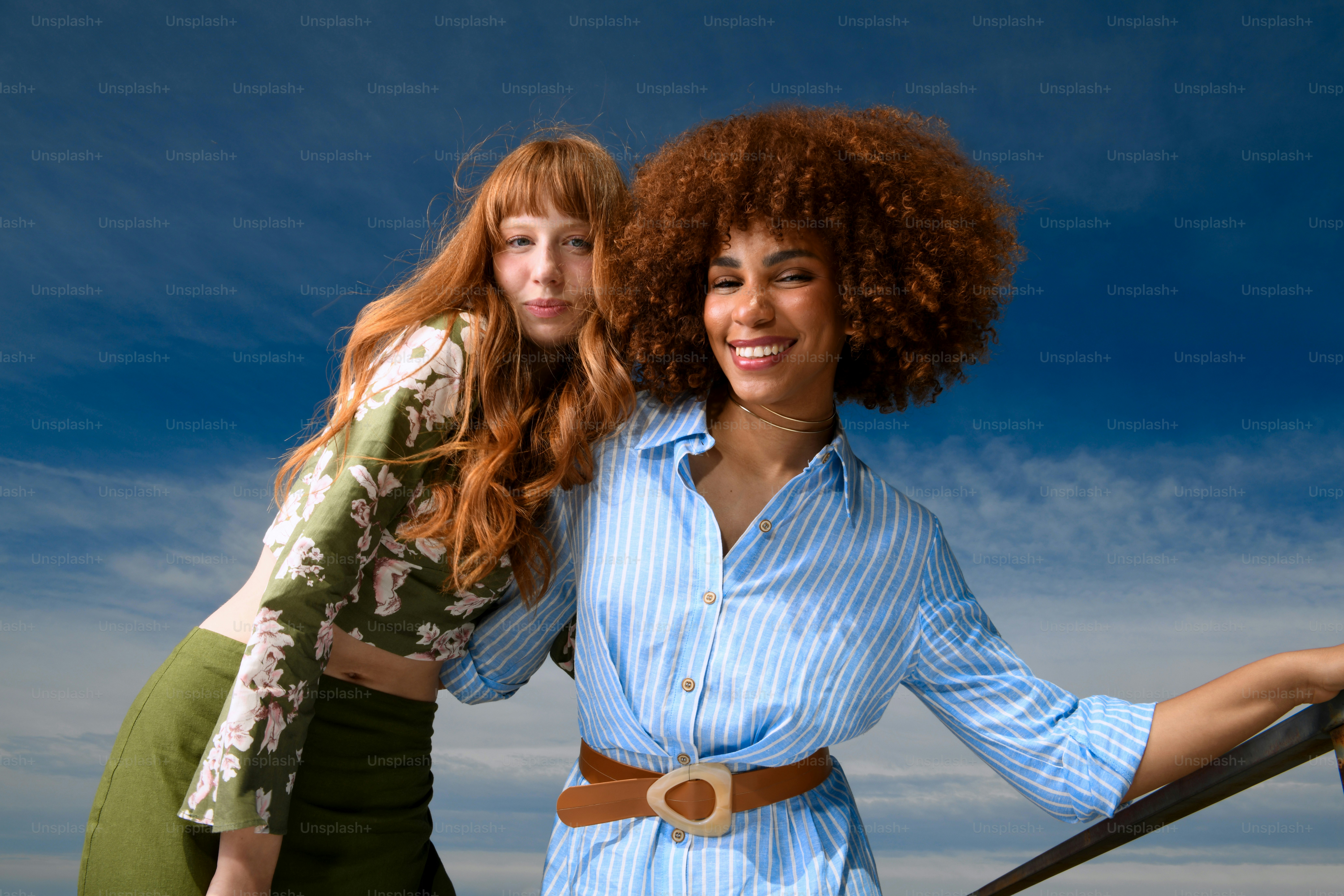 Two beautiful young women standing next to each other photo – Friends ...
