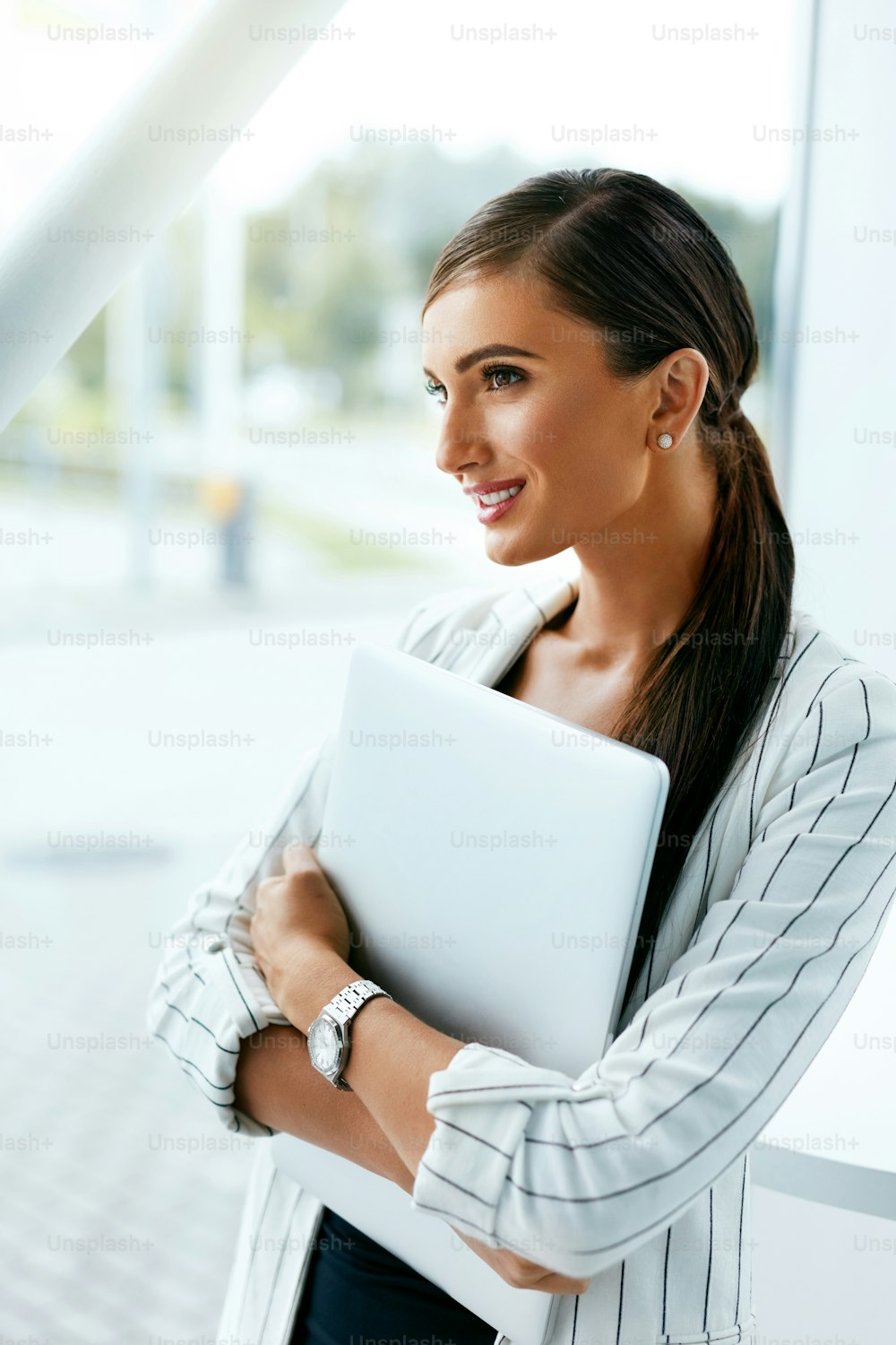Business Woman At Work With Notebook In Office. Beautiful Female With Computer Indoors. High Resolution