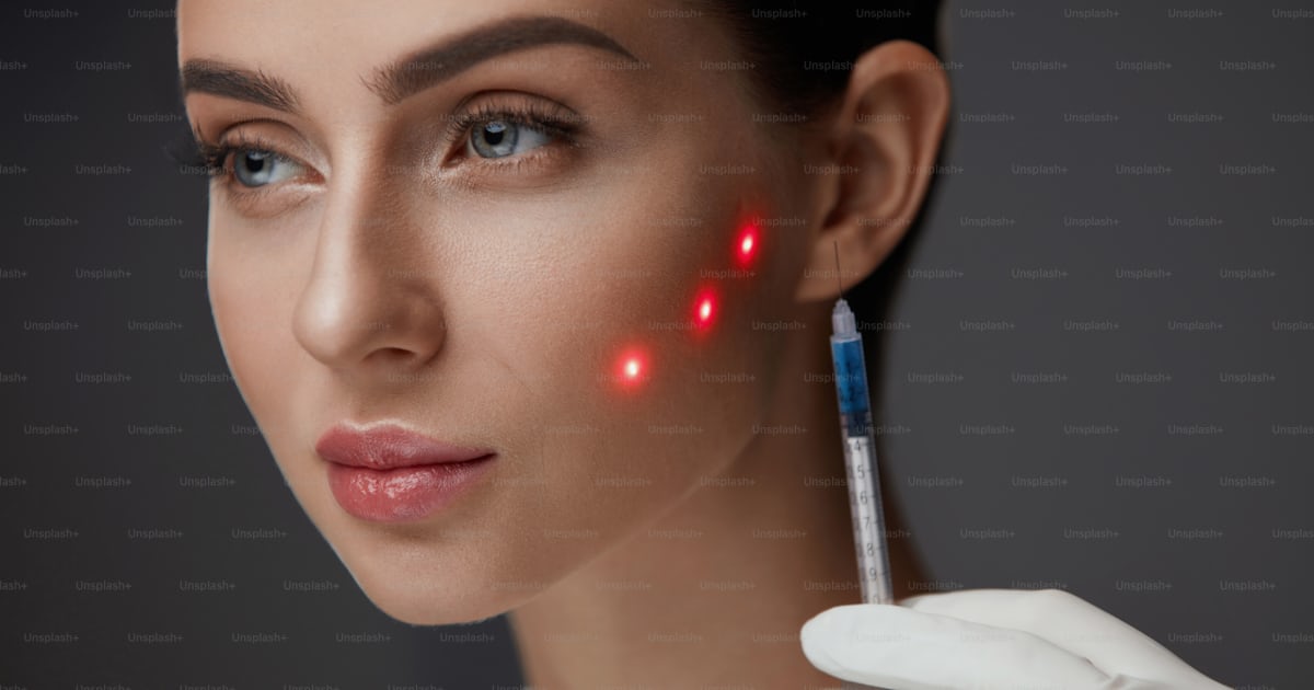 Beauty Injection. Beautiful Woman's Face With Red Laser Points On Skin ...
