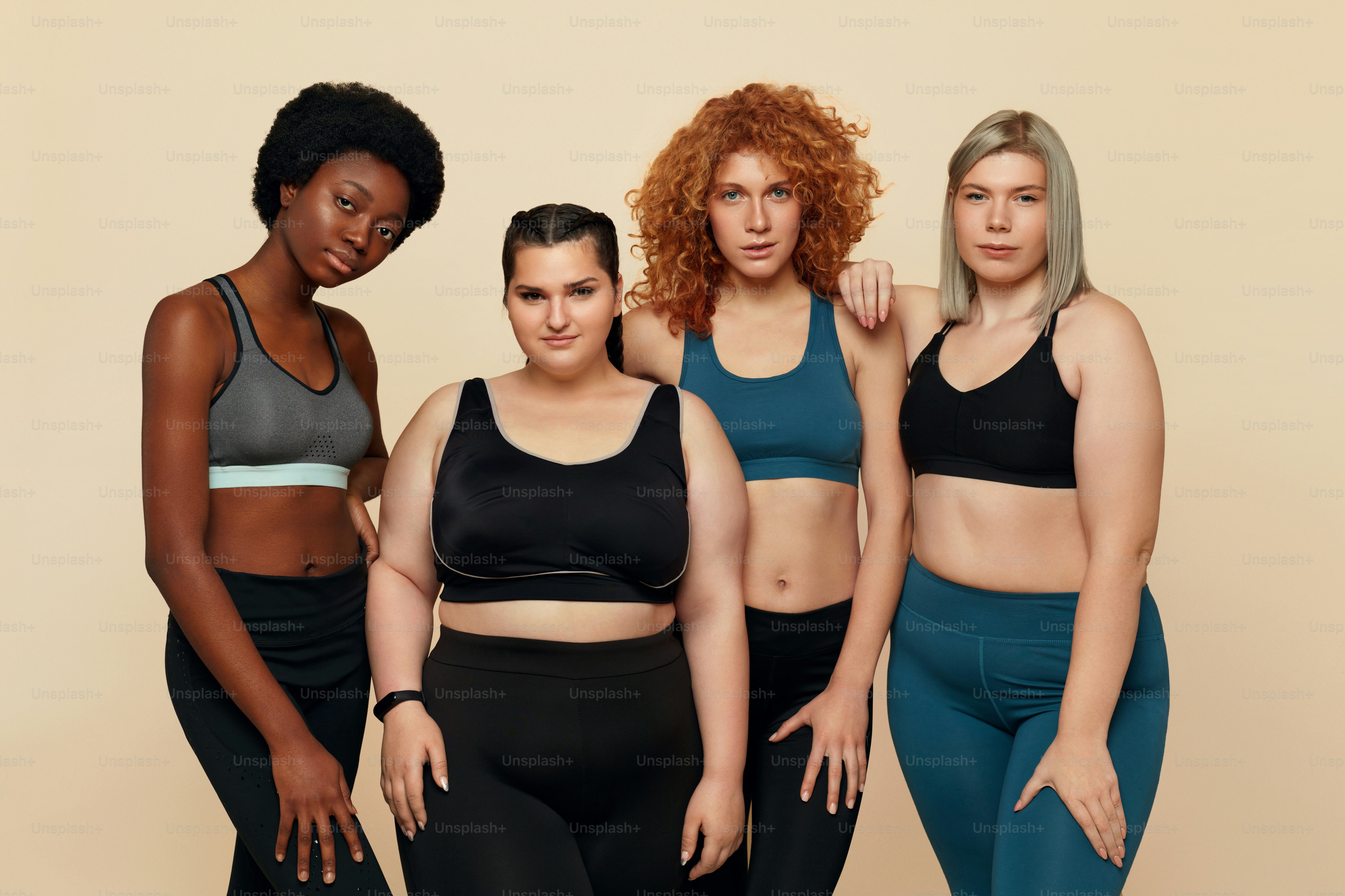 Different Race. Diversity Figure And Size Models Portrait. International Friends In Sportswear Posing On Beige Background. Body Positive As Lifestyle.