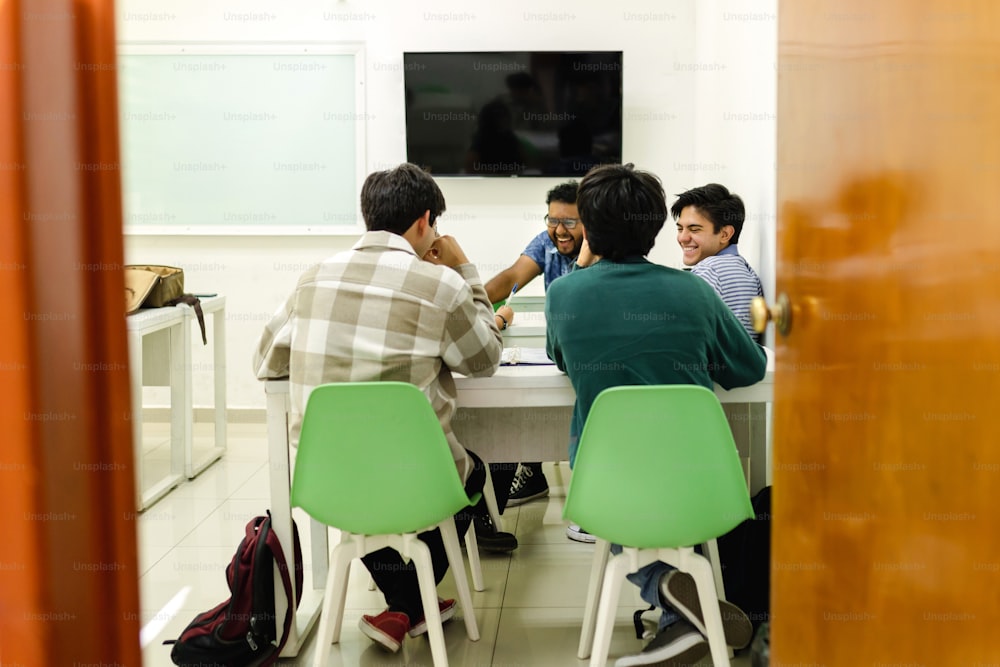 a group of people sitting around a table