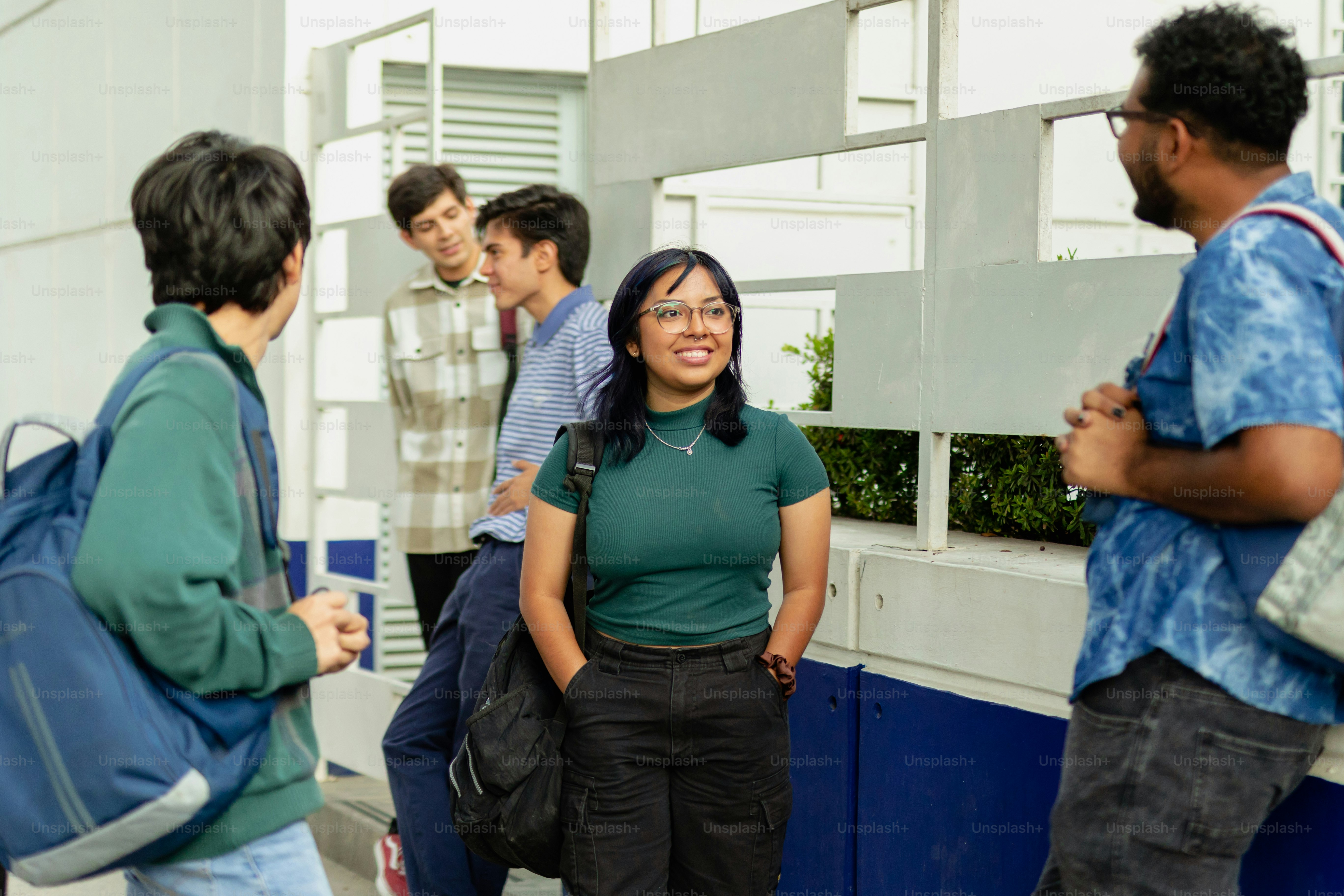 a group of people standing around each other