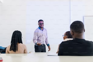 a man standing in front of a group of people