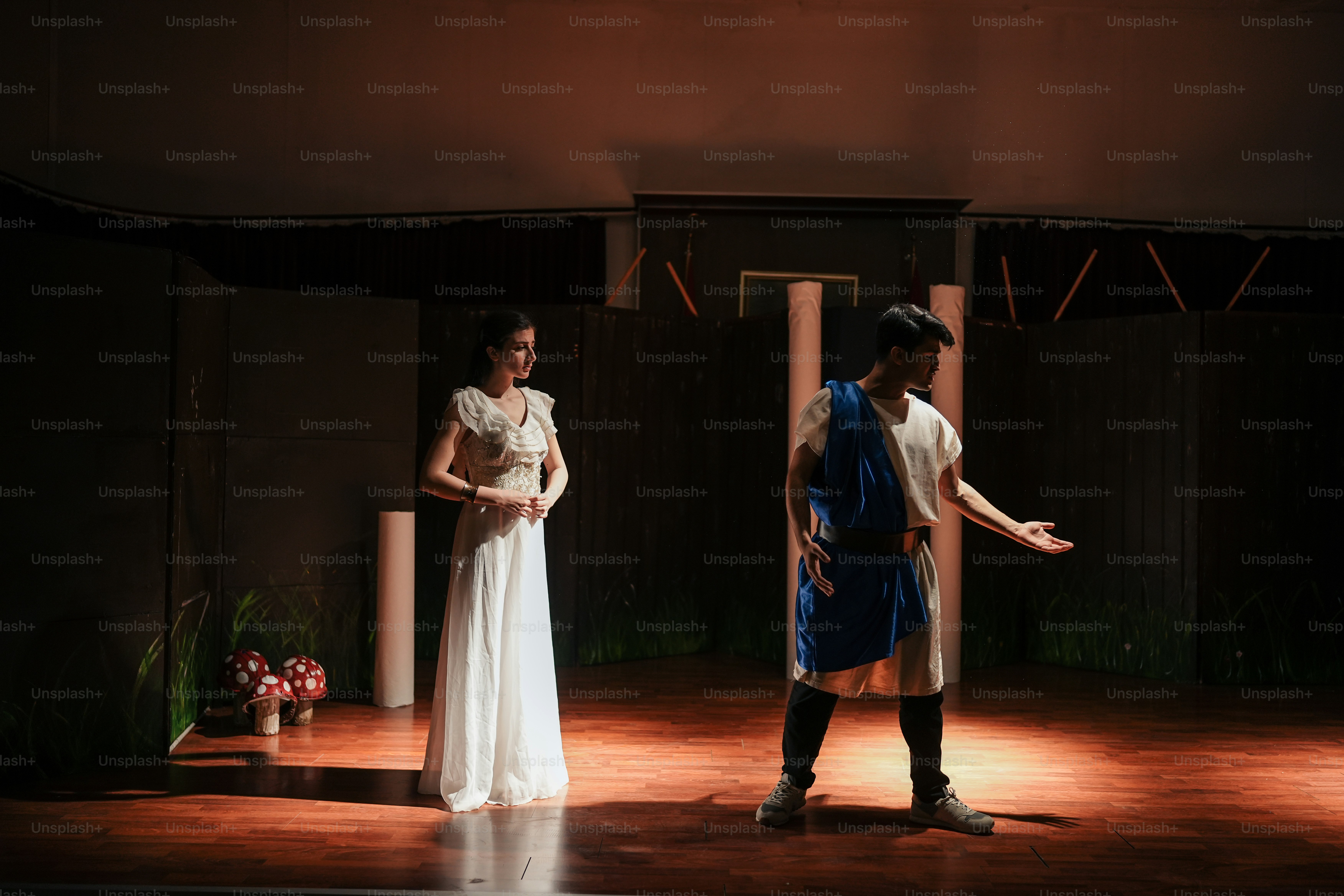 a couple of people standing on a stage