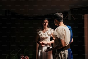 a man and a woman standing next to each other