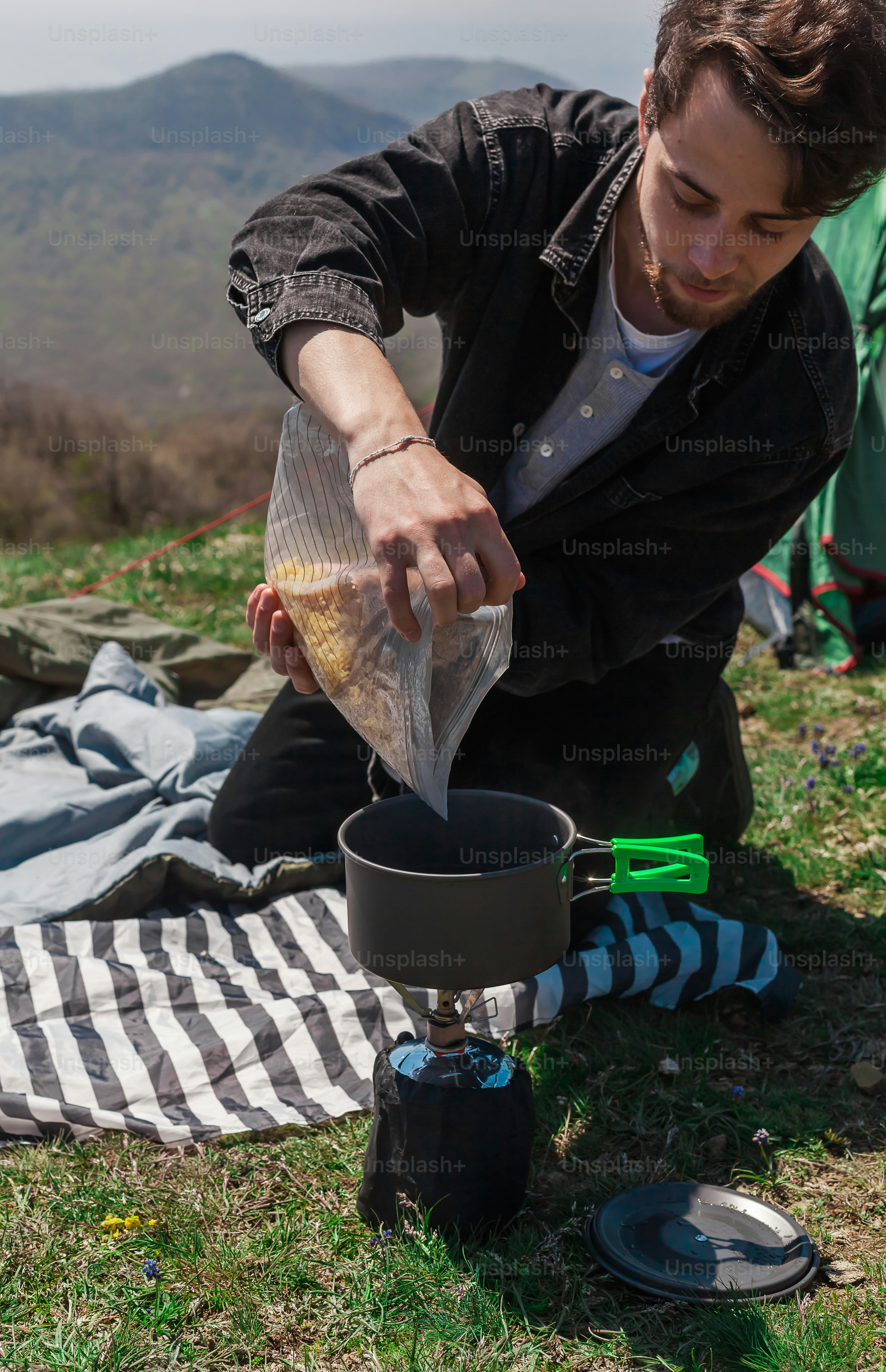 a man is pouring something into a pot