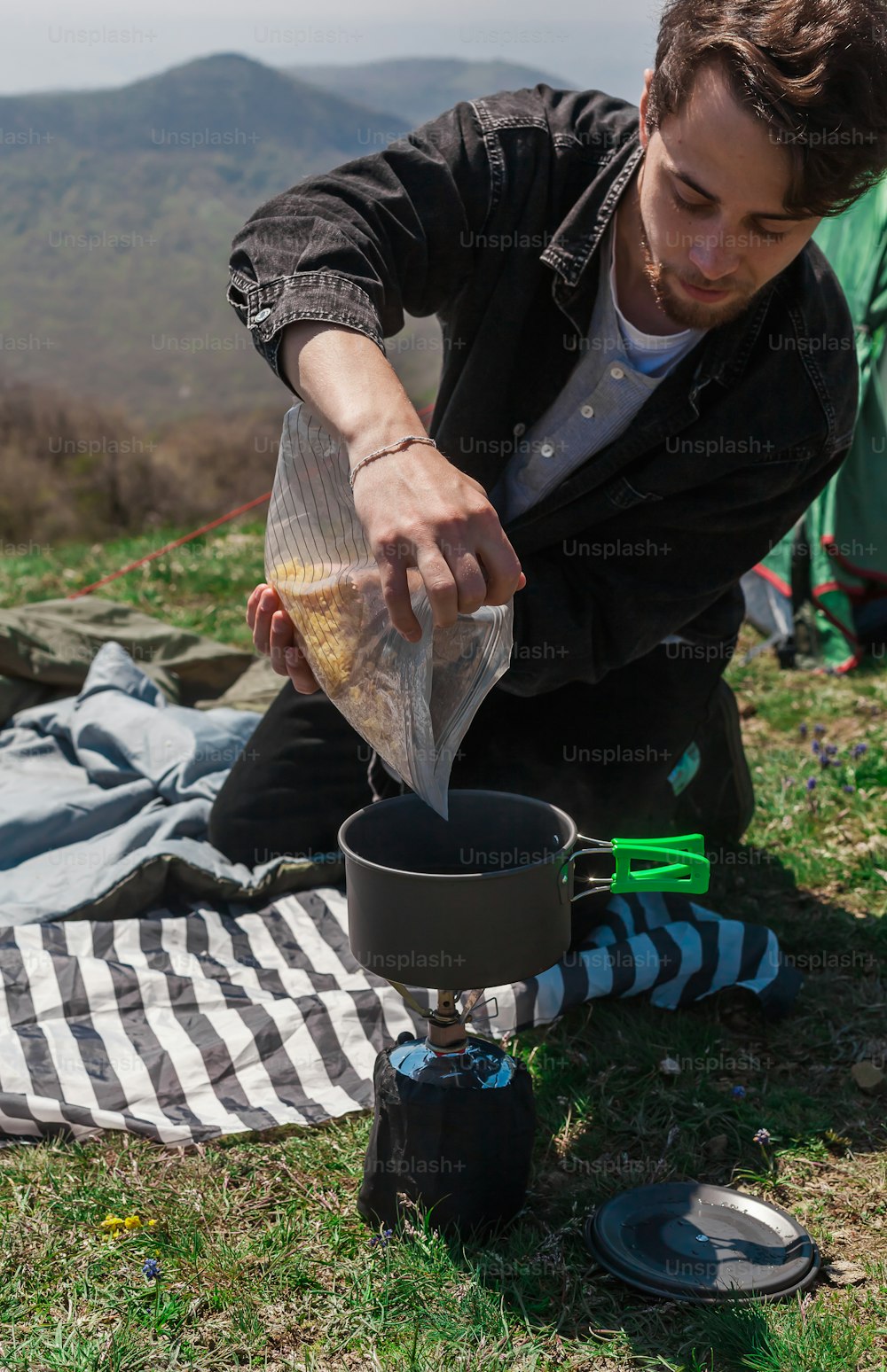 a man is pouring something into a pot