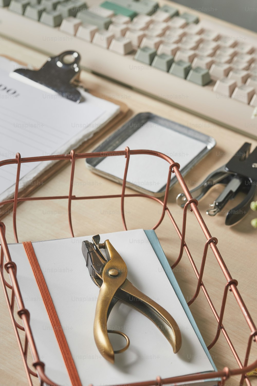 a pair of scissors and a clipboard on a desk