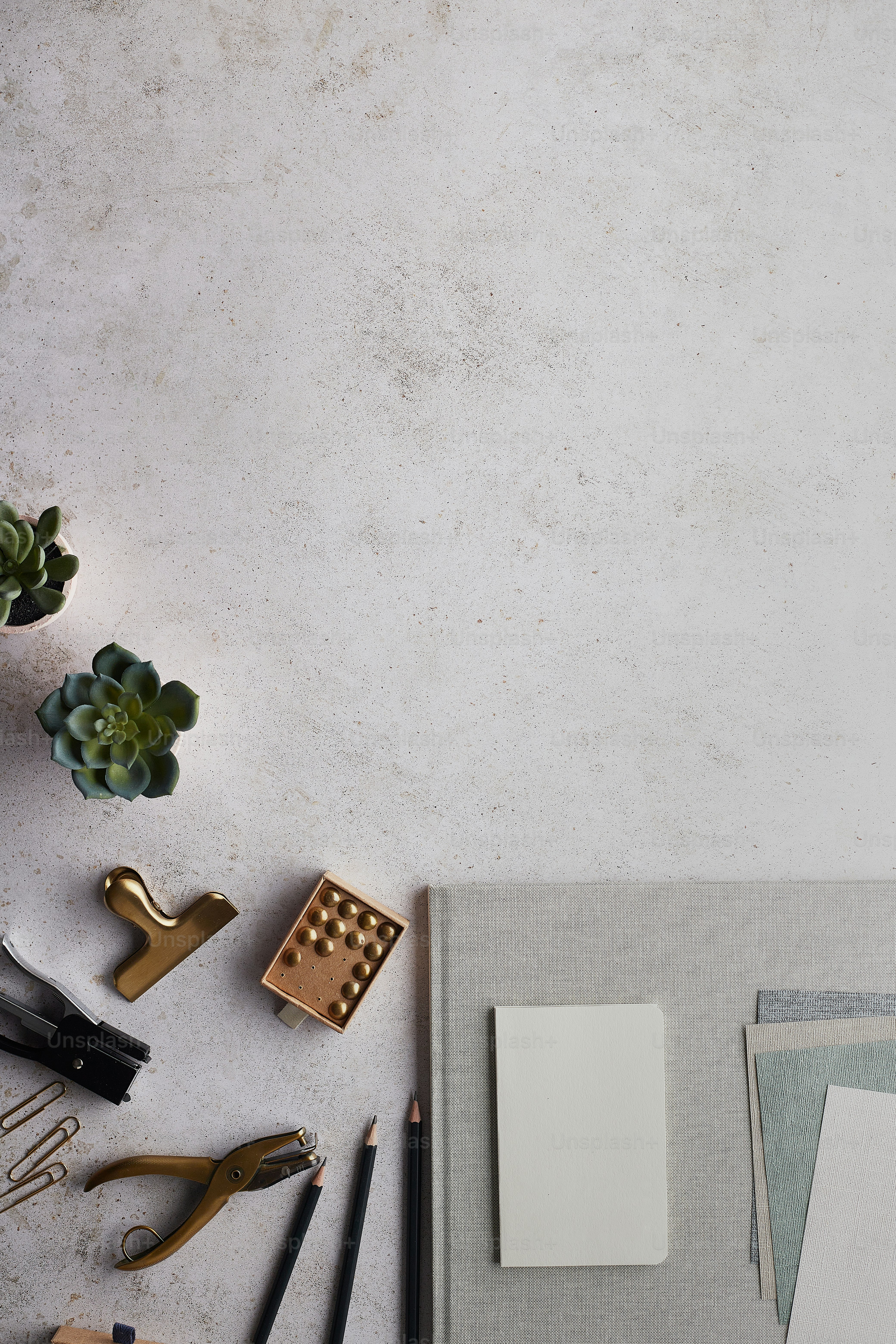 a table topped with lots of office supplies