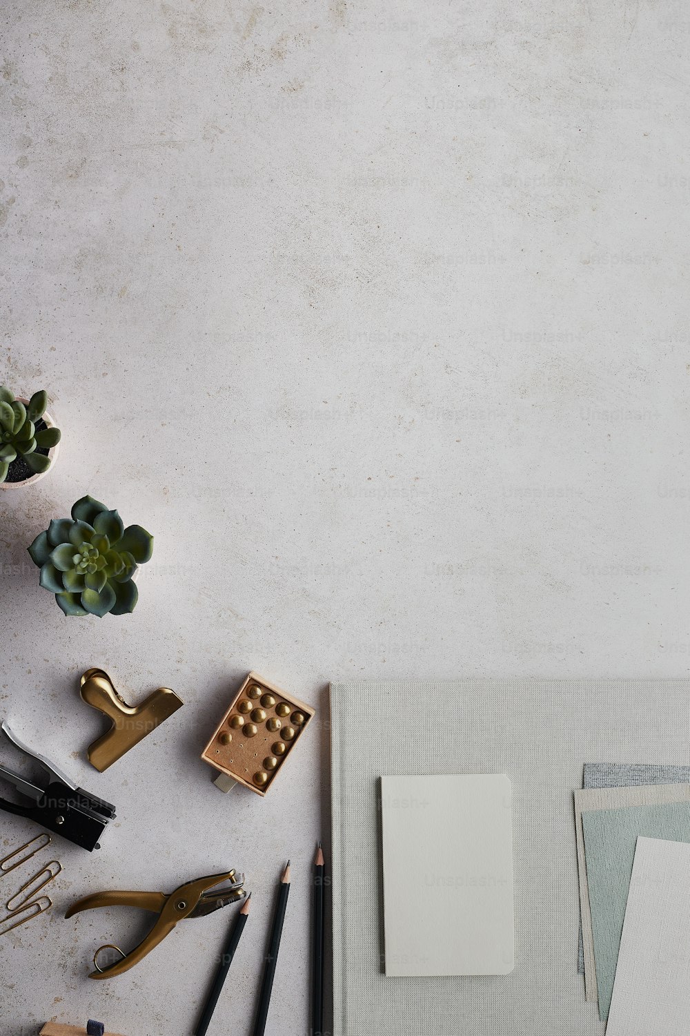 a table topped with lots of office supplies