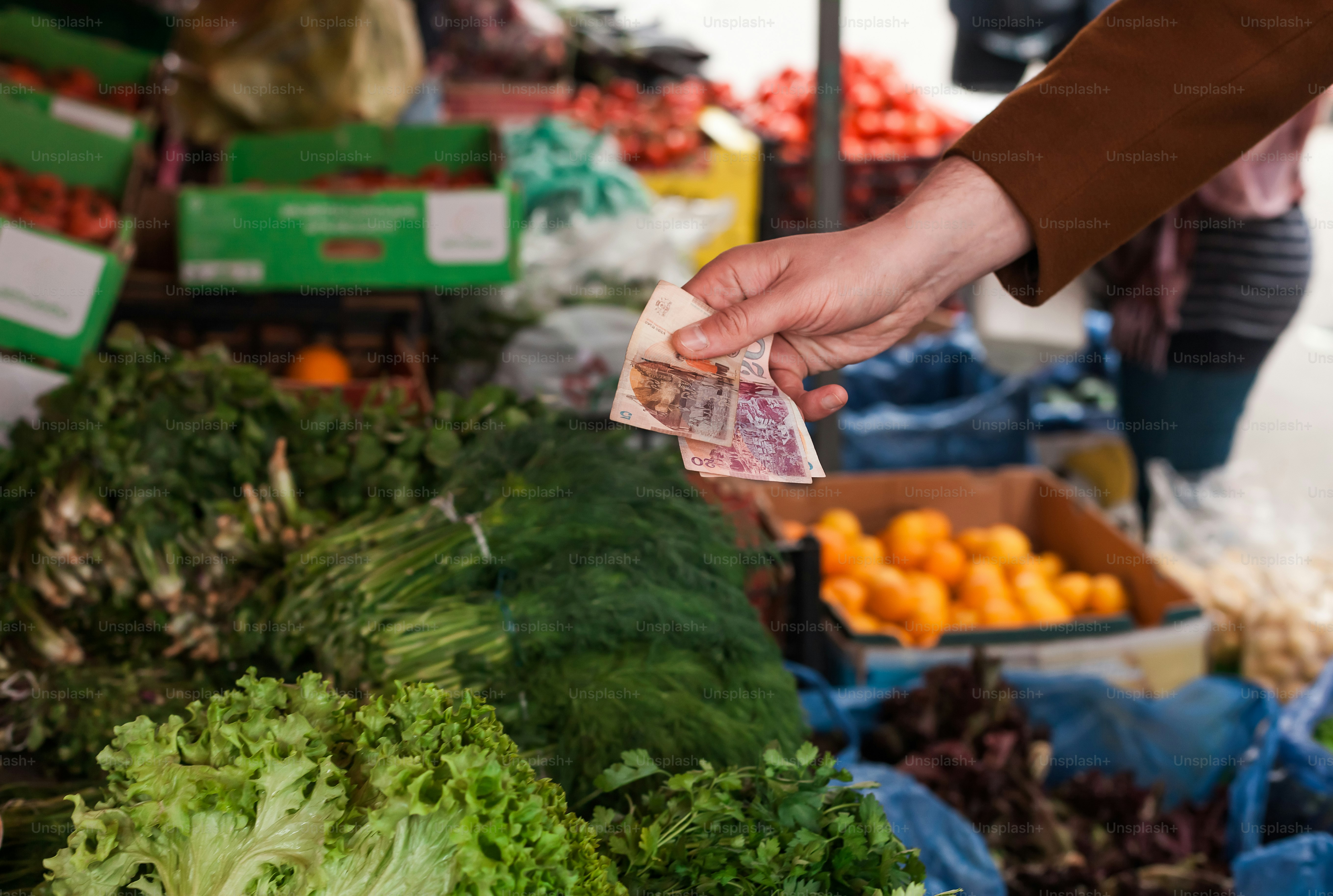 a person holding a piece of money in their hand