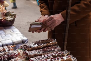 a person standing in front of a bunch of food