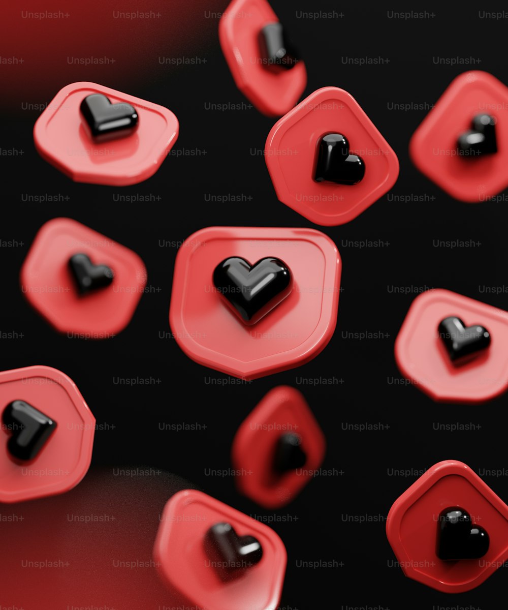 a group of red and black hearts on a black background