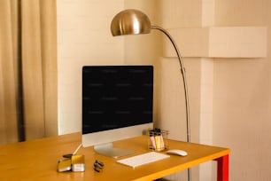 a desktop computer sitting on top of a wooden desk