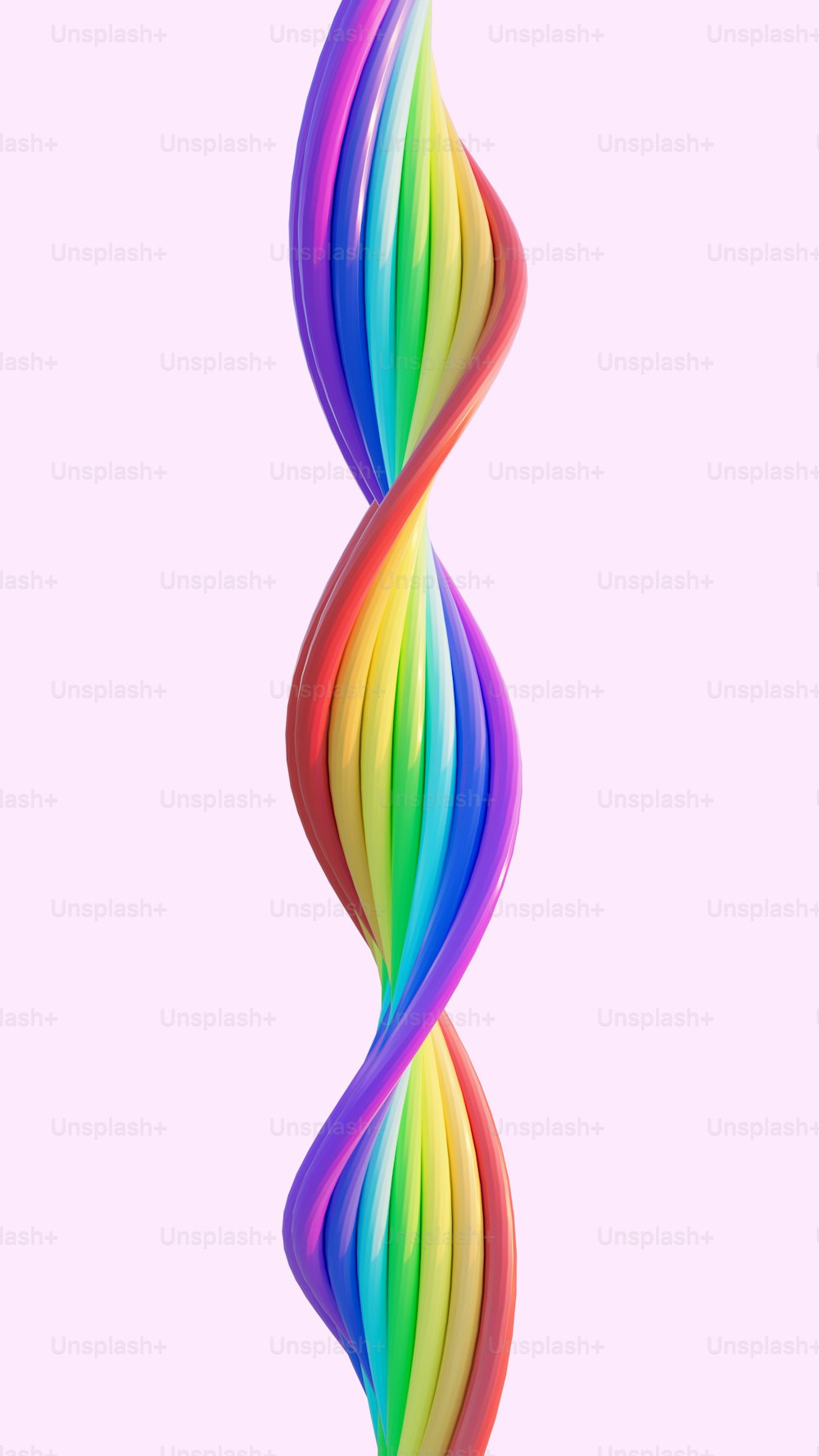 a multicolored spiral shaped object on a pink background