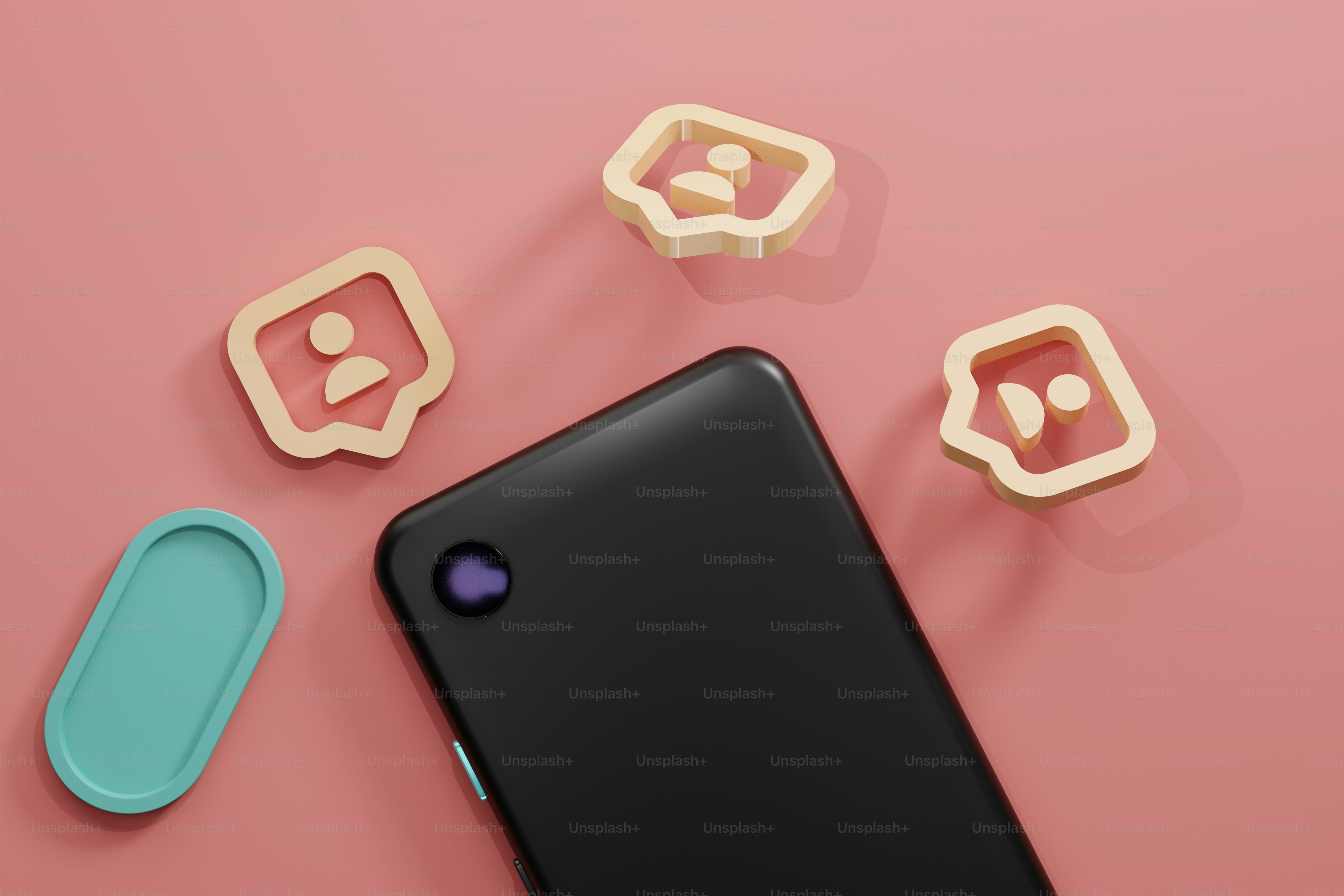 a cell phone sitting on top of a pink surface