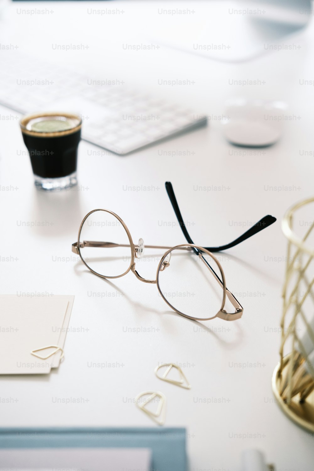 a pair of glasses sitting on top of a desk