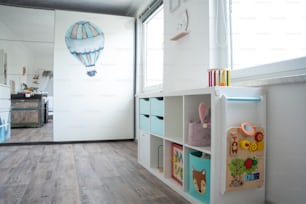 a room with a book shelf and a mirror