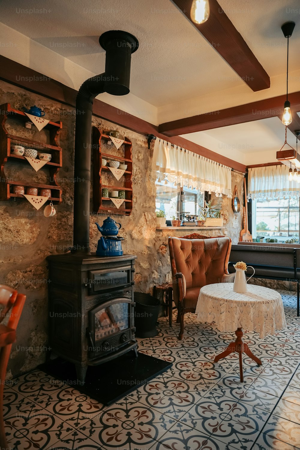 a living room with a fireplace and a table