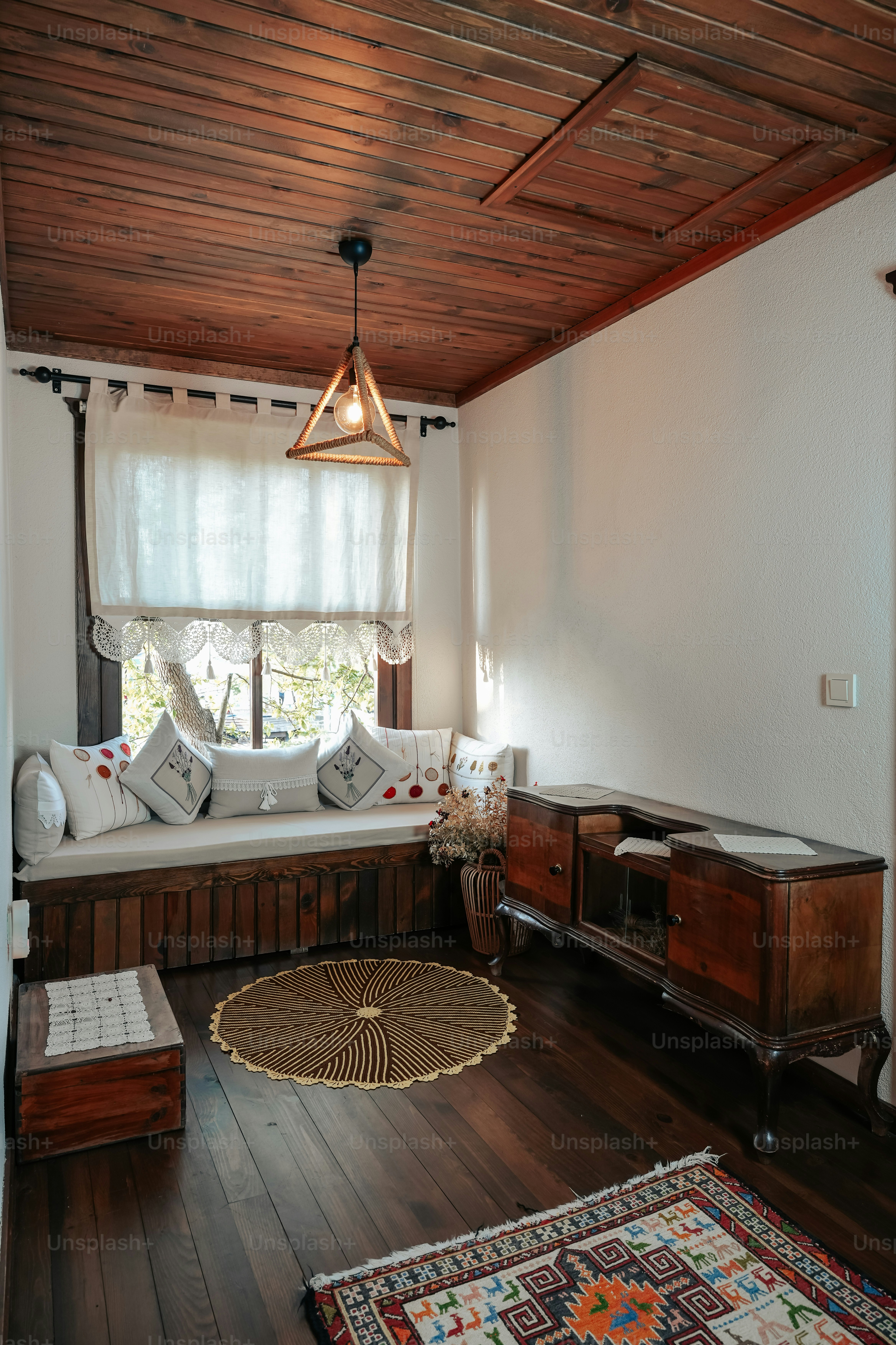 a living room with a couch and a rug