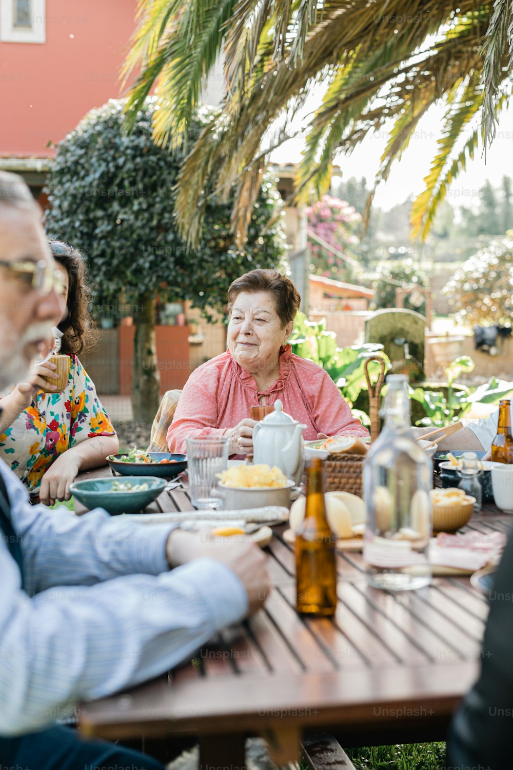 a group of people sitting around a wooden table