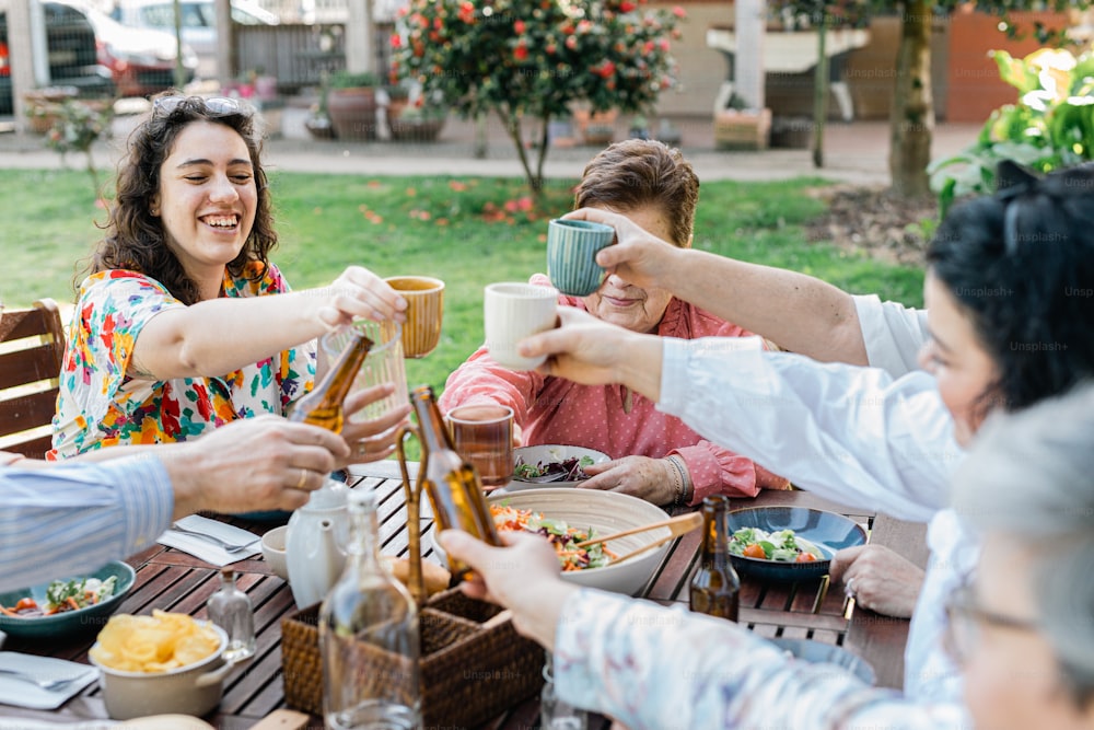 a group of people sitting around a wooden table