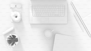 a laptop computer sitting on top of a white desk