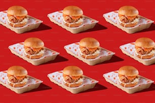 a bunch of sandwiches sitting on top of a tray