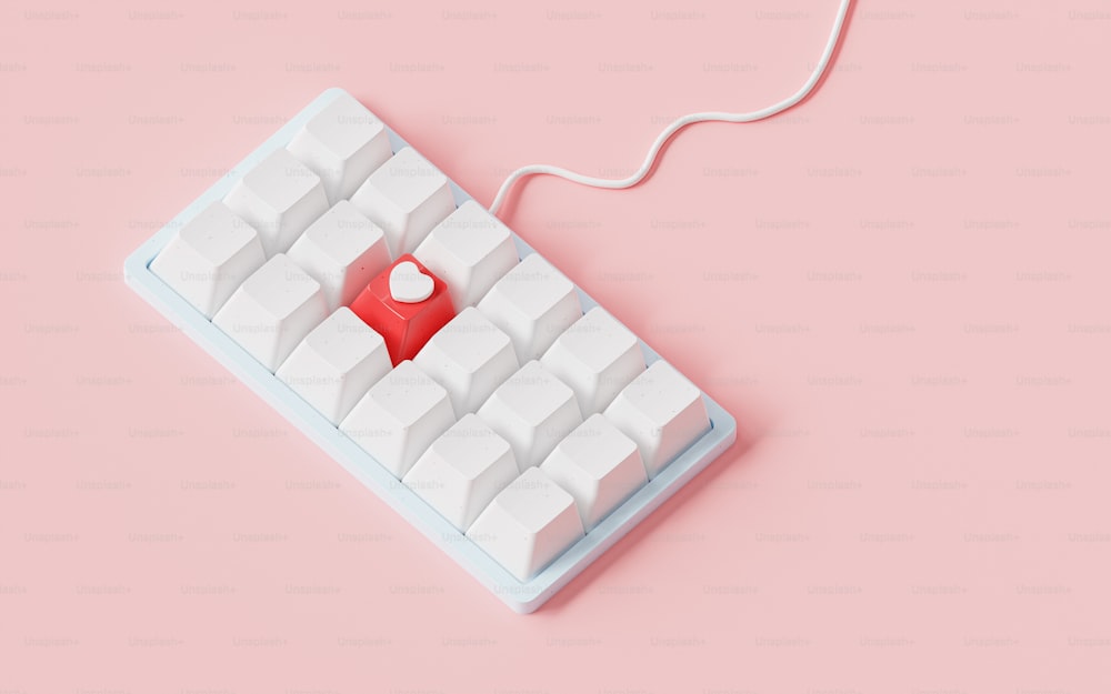 un teclado de computadora con un botón rojo
