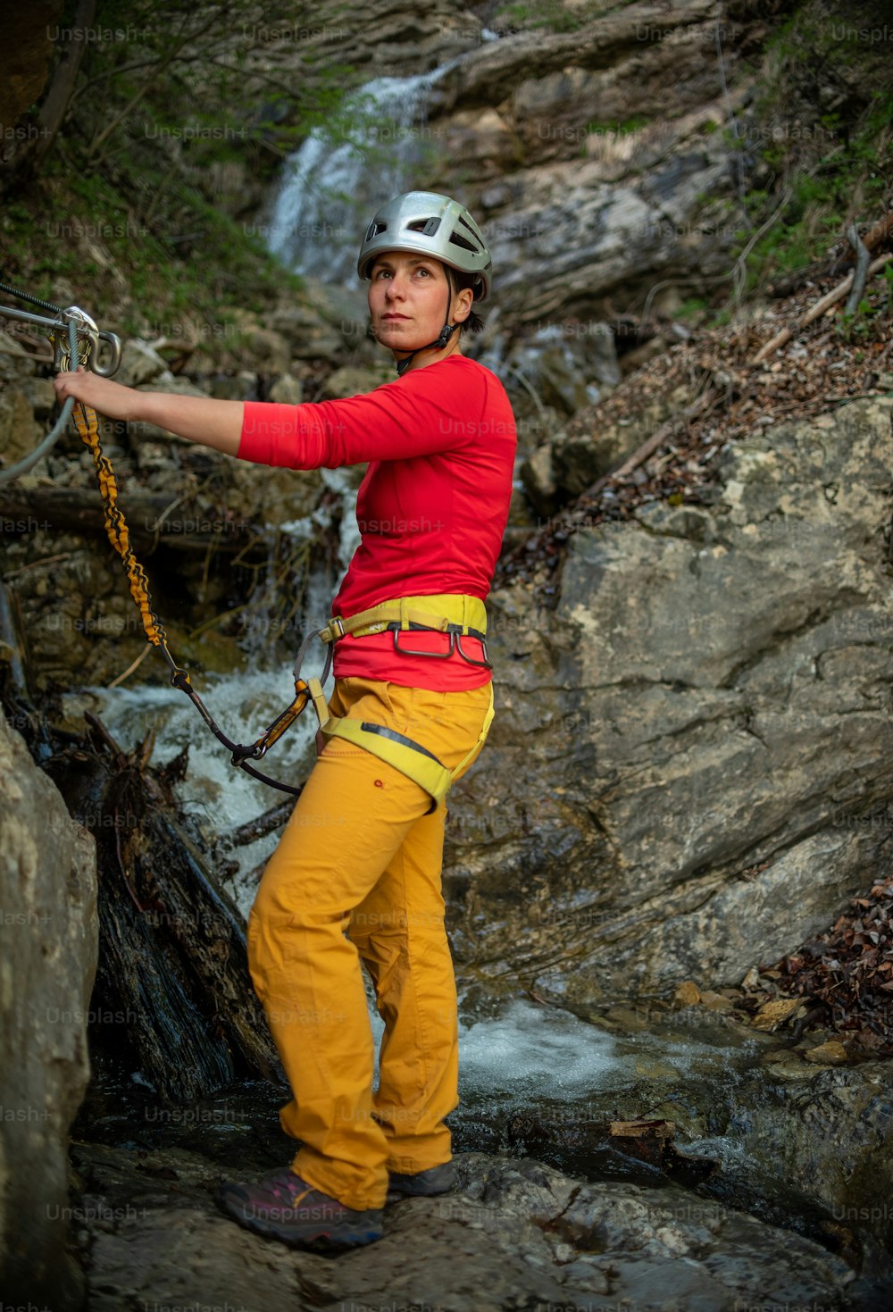 a man in yellow pants and a red shirt