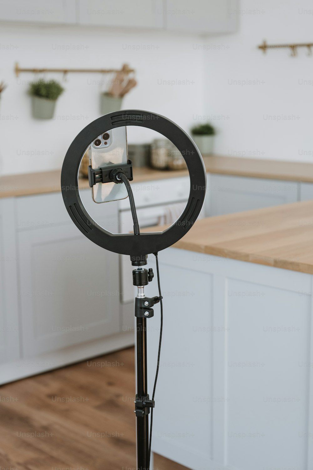 a camera on a tripod in a kitchen