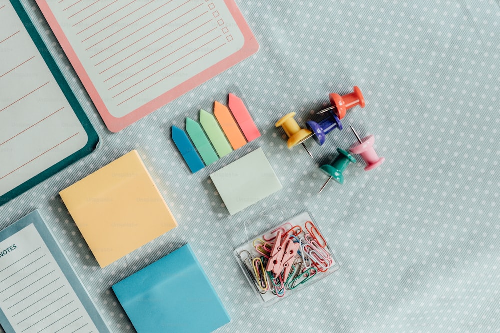 a table topped with lots of different types of stationery