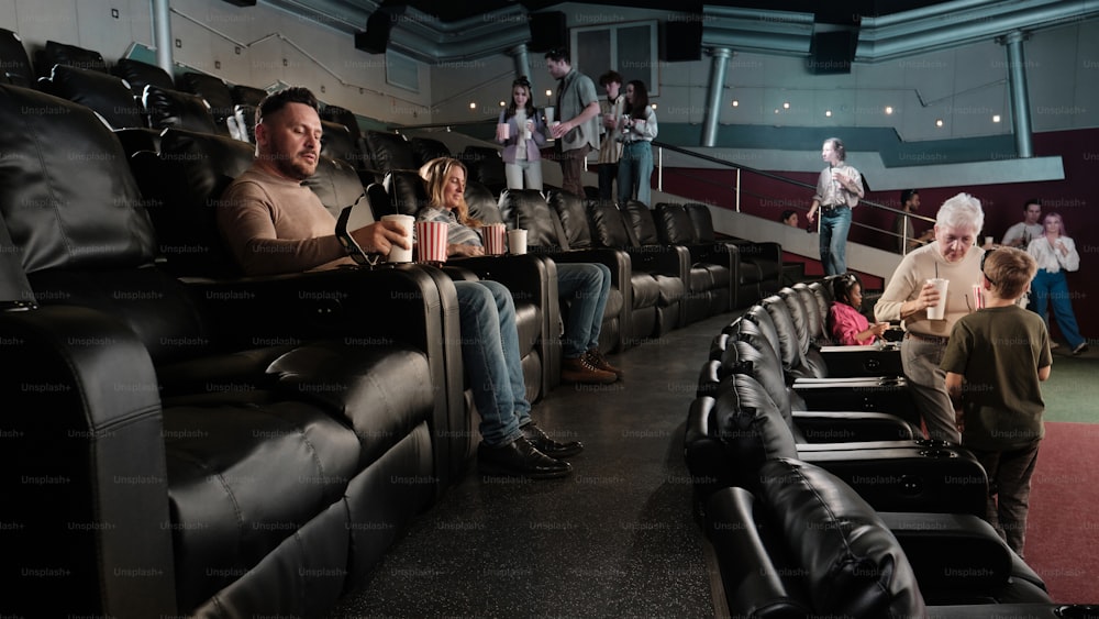 a group of people sitting in a movie theater