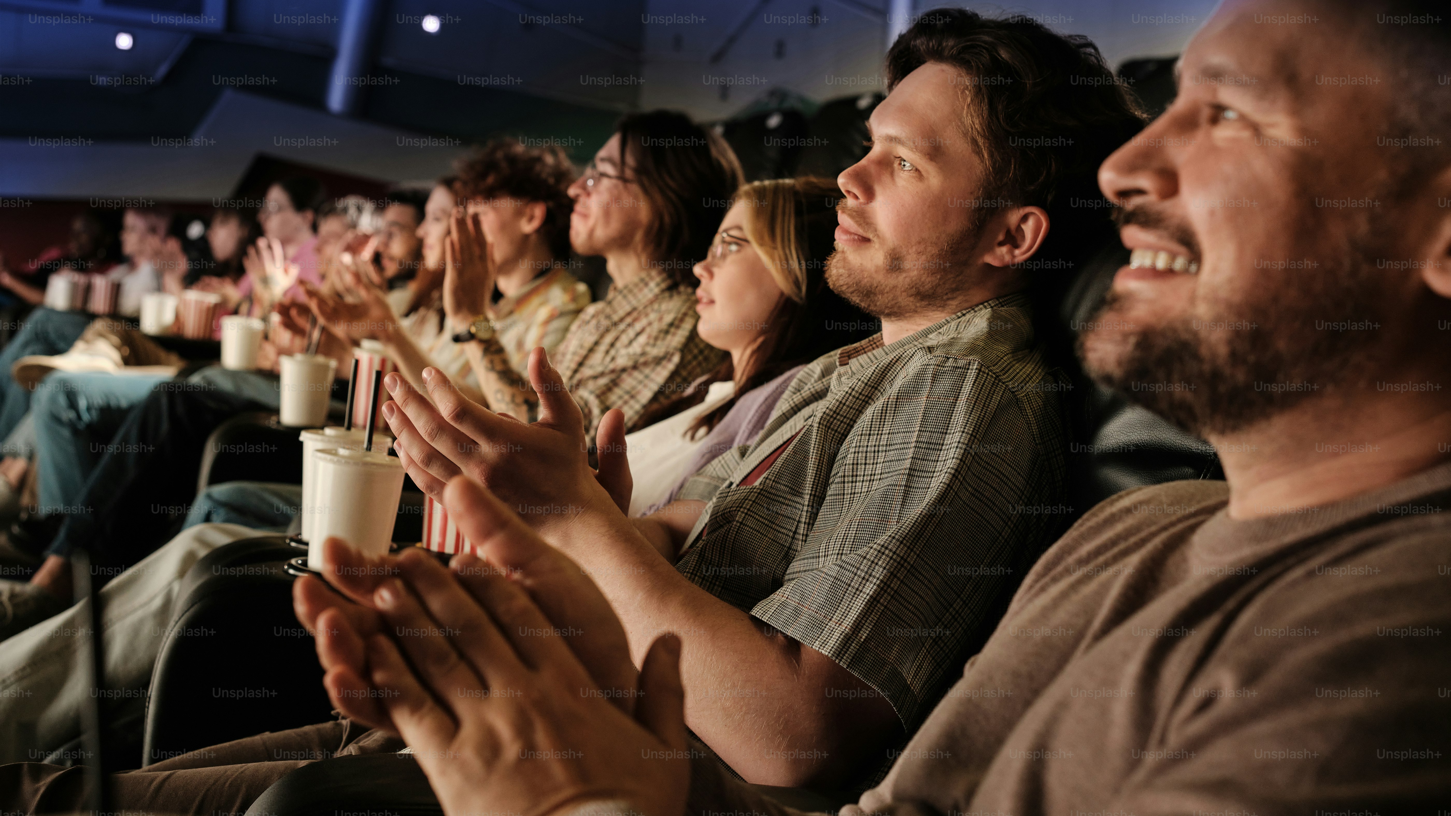 a group of people sitting next to each other