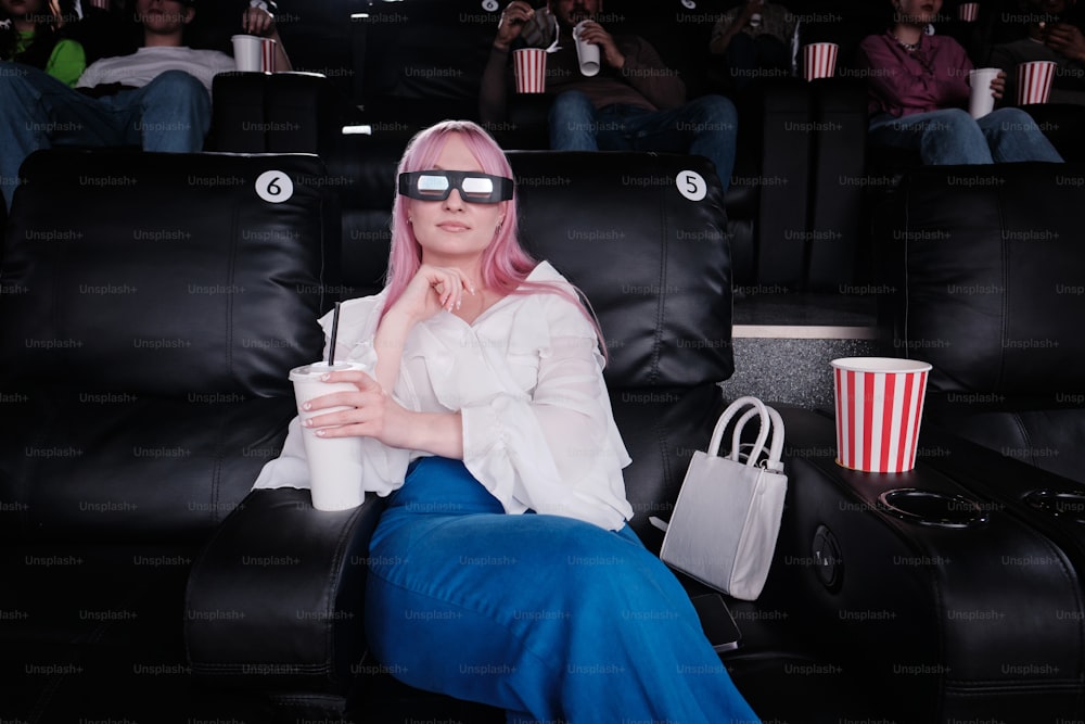 a woman with pink hair wearing 3d glasses