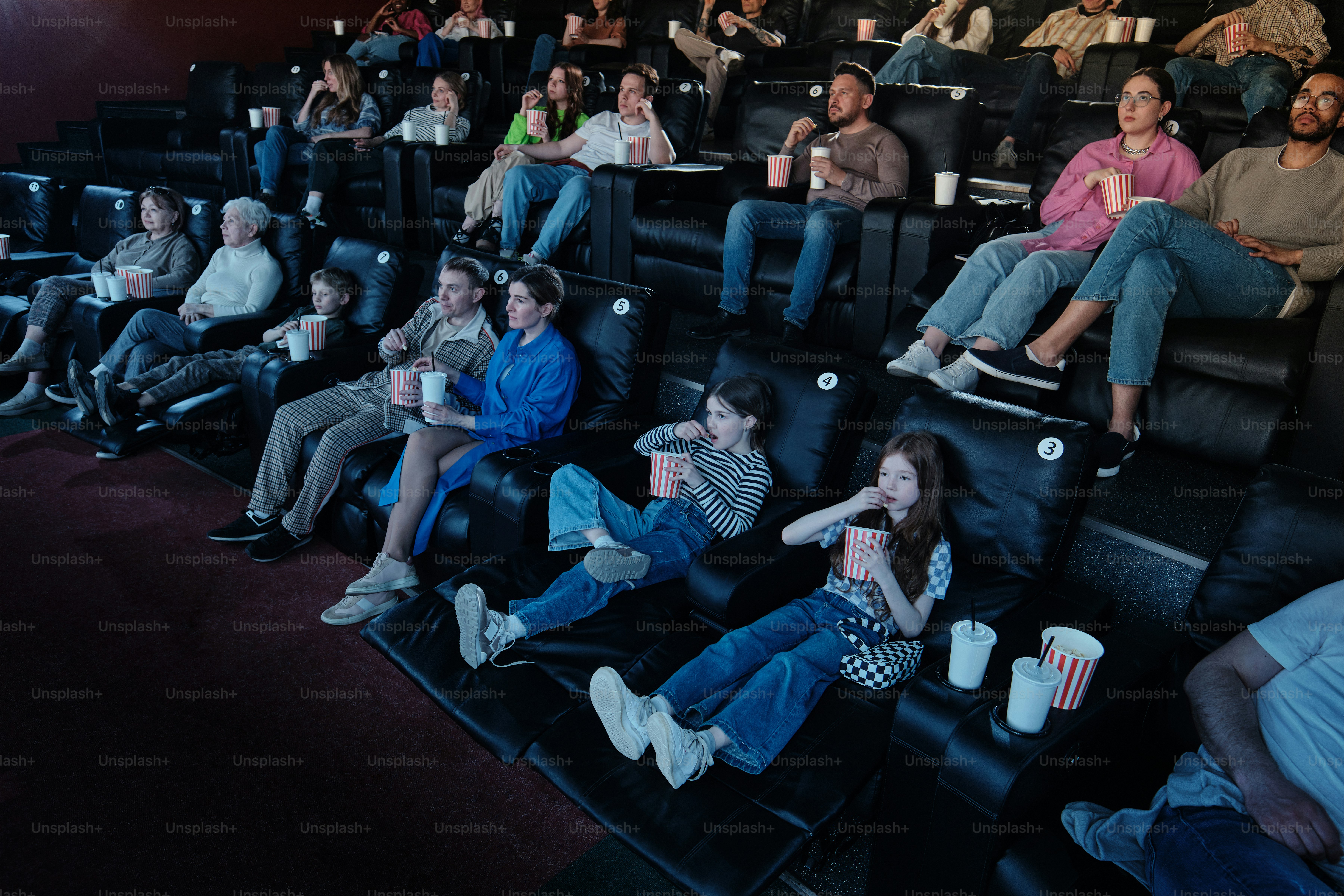 Movie theater audience looking up at screen