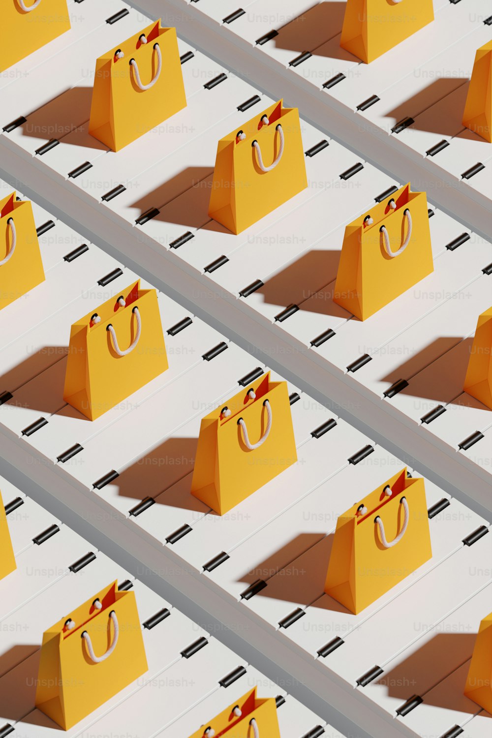 a row of yellow shopping bags sitting on top of each other